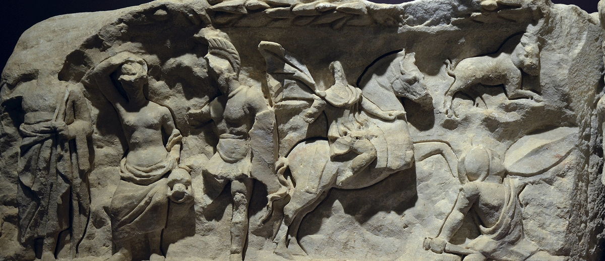 Two marble relief friezes from the Temple of Hadrian displayed on a wall in the Ephesus Archaeological Museum