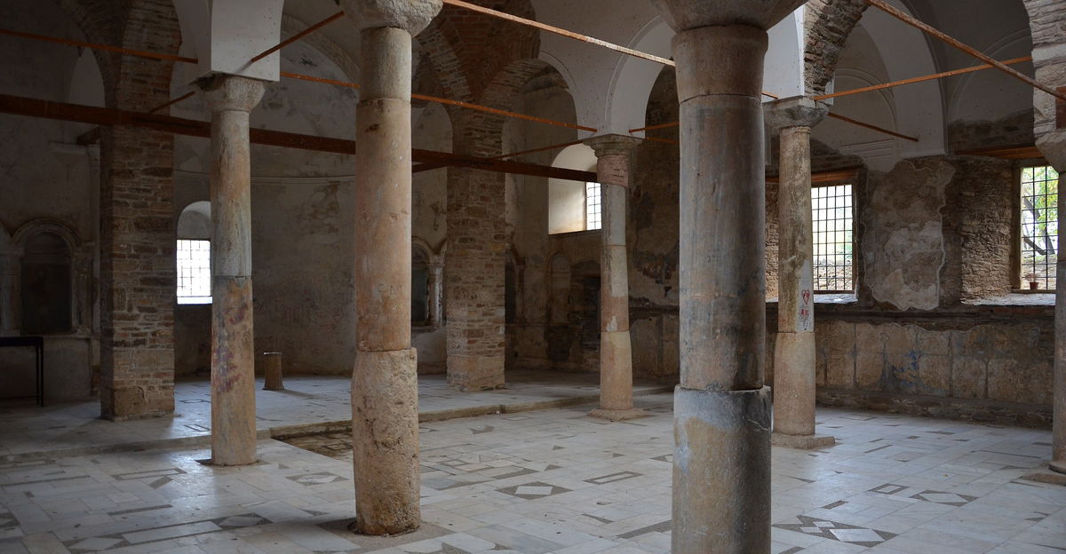 Interior of the old Greek Orthodox church at Şirince with a stripped wooden screen still showing blue and gold painted panels